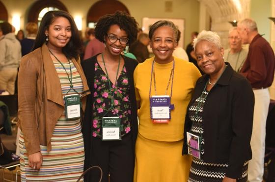 Photo of four Chatham University women smiling at an event